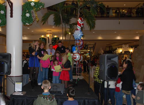The O'Brien family, representing Catie and the Catie's Wish Foundation attended the sculpture lighting at the Harrisburg Mall opening the Christmas season.  Pictured here are the O'Brien's in St. Jude t-shirts standing with Santa as the sculpture is lighted.